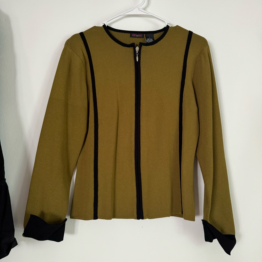 Olive green zip up jacket with black piping